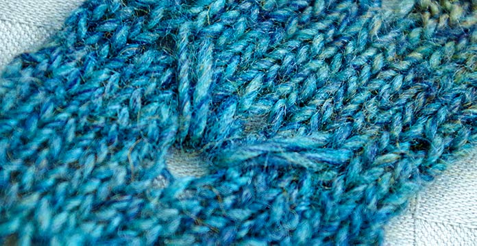  Three longer loops create a Trillium flower motif knit with Colorburst yarn.