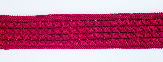 Because of the pattern elements, the wrap can stretch wide to 18" or retract to 9" if used as a scarf.