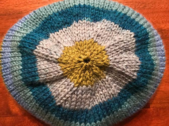 The top of my hat. Here is another angle on the stripes at the top of the hat, and the reason there are so many pompom's on the hats I make.