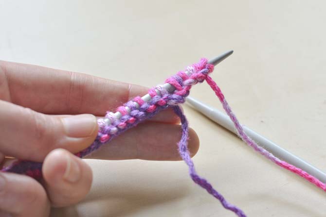 Add a few more stitches to the end of your cast on row by using cable cast on.