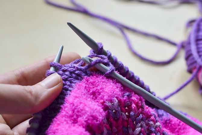 Step 3: Use the crochet hook to grab the loose bar just above the dropped stitch....