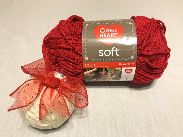 The ornament is wrapped in Soft yarn in the color Off White.