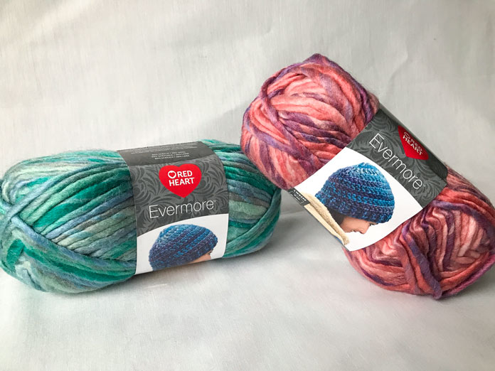 Two skeins of Evermore in the colors Cabana (left) and Cotton Candy (right)