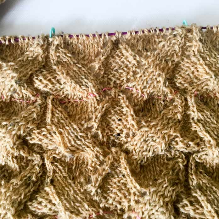 Arum Shawl in progress showing a pink thread weaved in it to identify a lifeline, and green stitch markers at the top; Fibra Natura Kingston Tweed - Ochre, KNITTER'S PRIDE The Mindful Marker