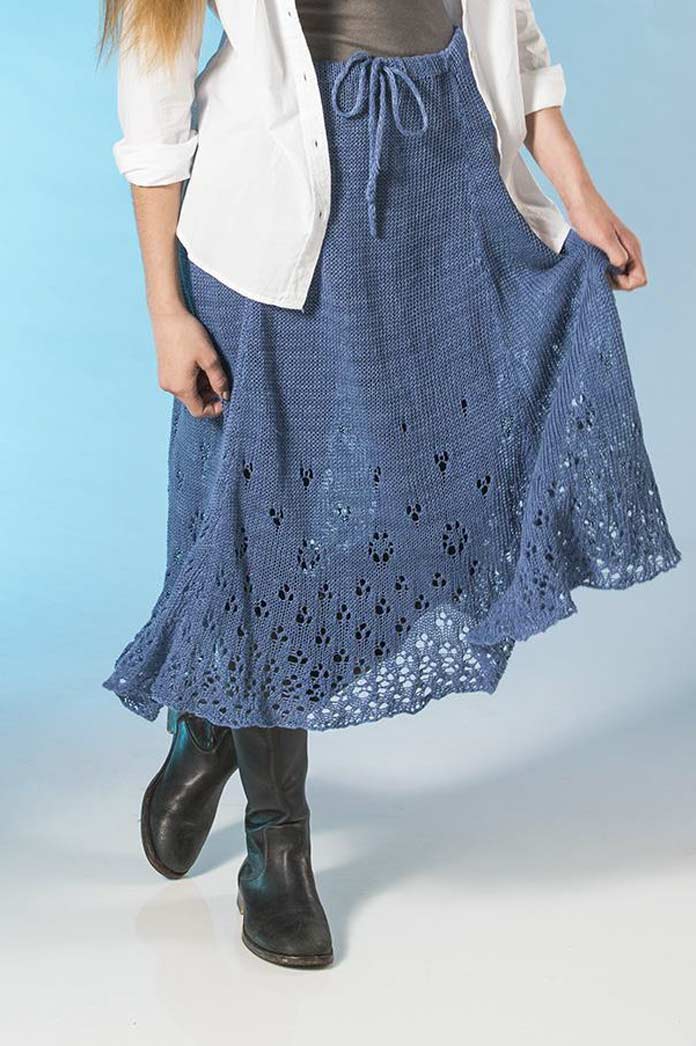 The Eyelet Skirt pattern using Fibra Natura FLAX yarn in Adriatic colorway worn by a model