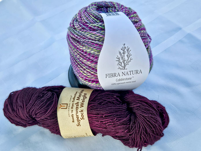 Rit Dye in Eggplant and FIBRA NATURA Cobblestone in Blacklight; FIBRA NATURA Cobblestone which is a soft, 2-ply 100% merino wool yarn