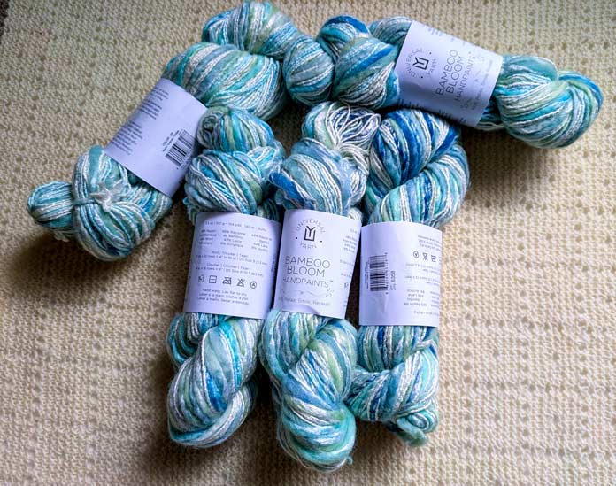 Five skeins of Bamboo Bloom Handpaint yarn in color Nami.