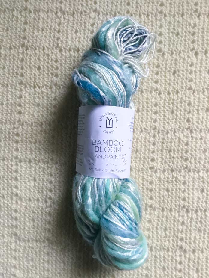 One skein of UNIVERSAL YARN Bamboo Bloom Handpaint yarn in color Nami.