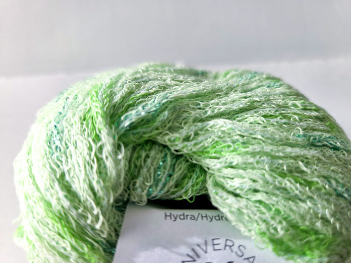 A ball of UNIVERSAL YARN Constellation and a close-up of color Hydra