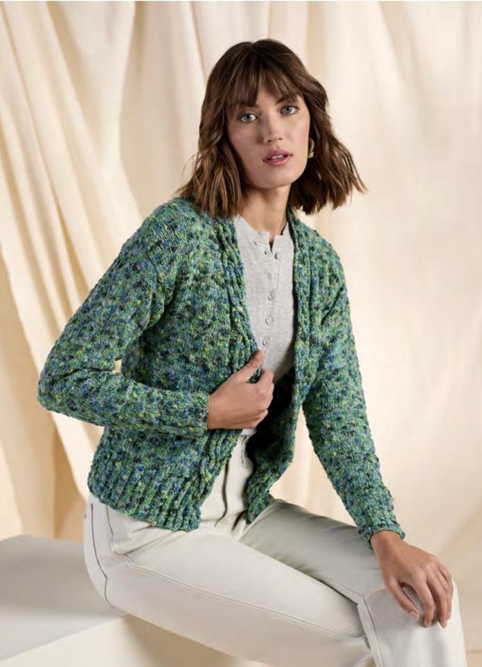 A young model wearing the Lawson Cardigan, a transitional knitwear.