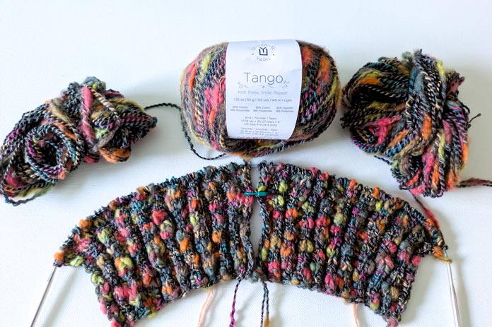 Two sleeves for the Lawson Cardigan worked at the same time, using two balls of yarn and a labelled ball of yarn.