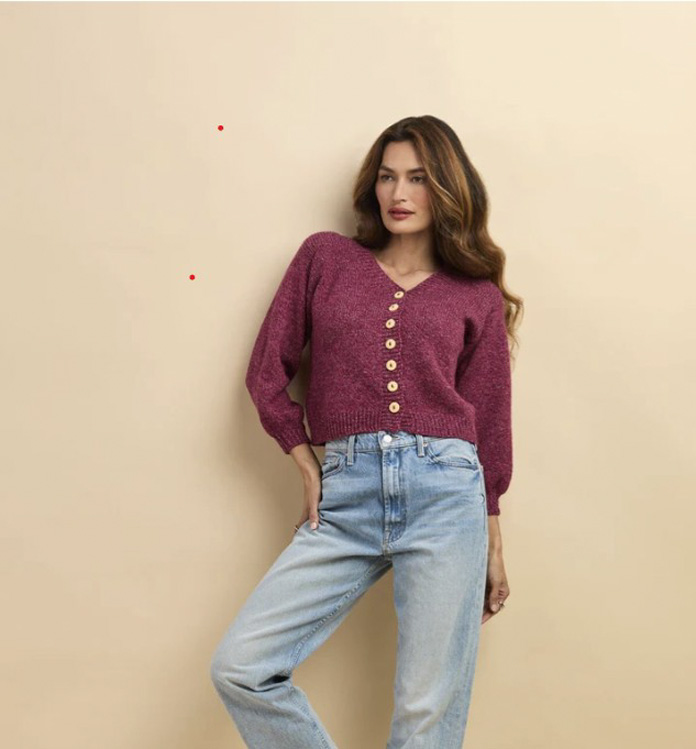 A young woman wearing a knitted cardigan