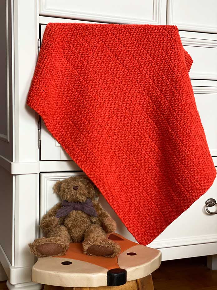 Knitting Sequence Textures Baby Blanket by Nancy Lekx for ANPTmag Issue 66; photo by Carla A. Canonico