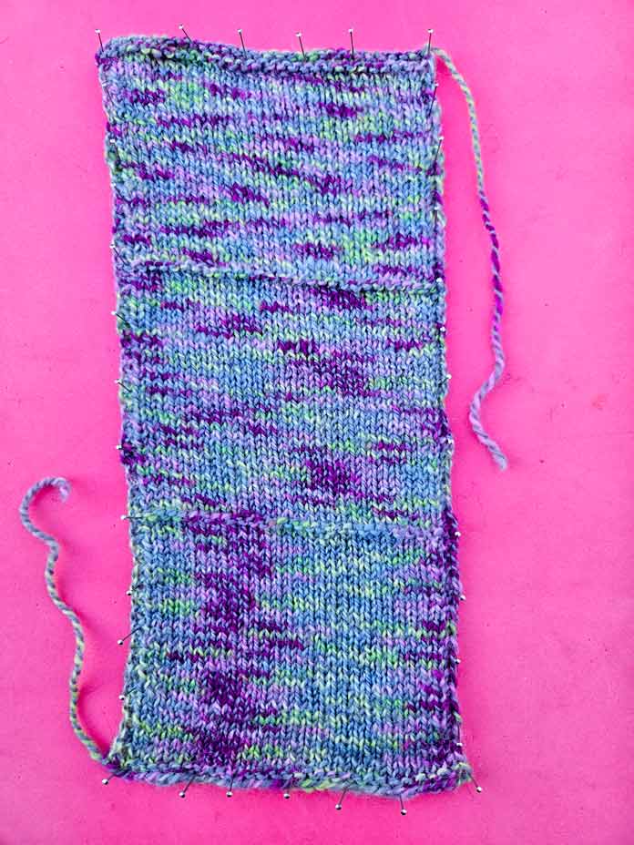 One large swatch that was knitted with 3 different needle sizes to measure the gauge and the color pooling potential; FIBRA NATURA Cobblestone which is a soft, 2-ply 100% merino wool yarn