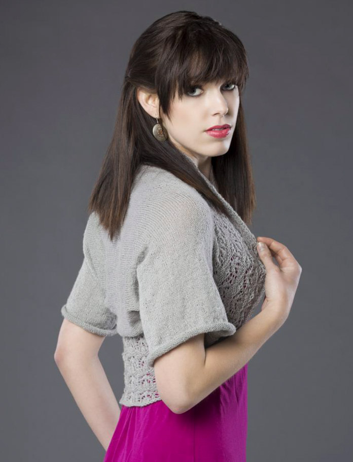 A model wearing the knitted Lotus Shrug