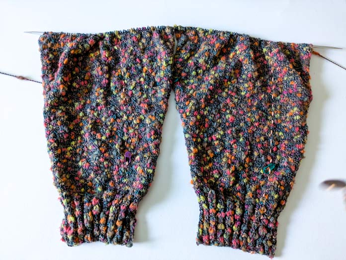 Finished sleeves with live stitches left on the needle.