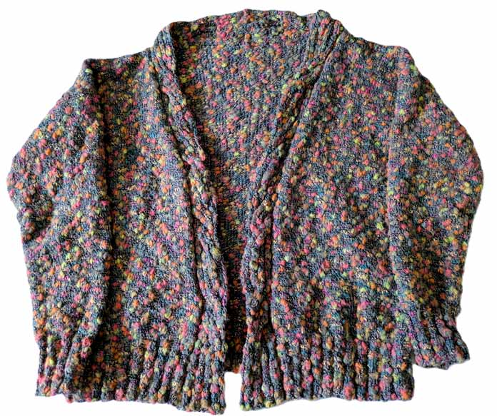 A lying flat cardigan worked in multicolor thick and thin yarn.