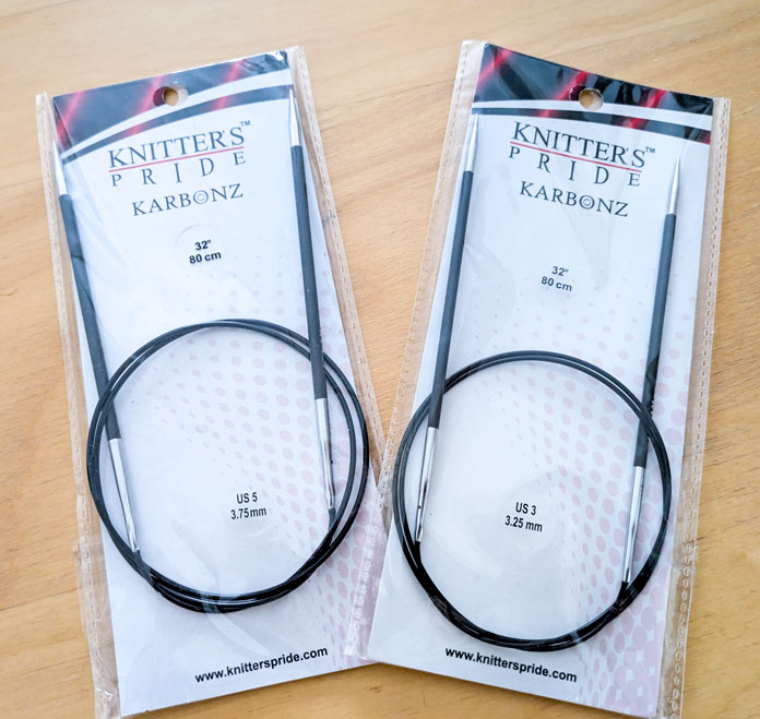 Two sets of circular needles, each in a different size.