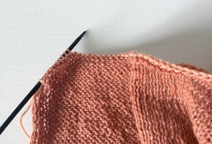 A knitted stitch creates the edge of the first and last square in the work; Fibra Natura FLAX, LANTERN MOON Destiny Circular Needles