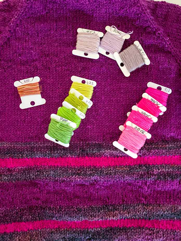 DMC cotton floss in pink, green, and purple shades to embroider on the Experimental Pullover; Sulky Sticky Fabri-Solvy, DMC floss, DMC Chenille needles