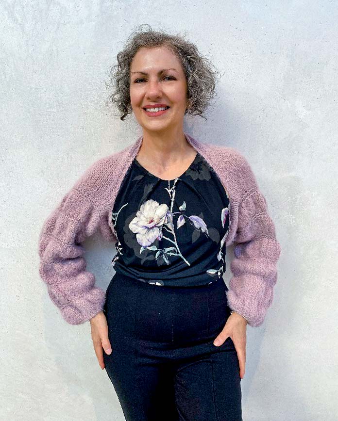 Carla A. Canonico is wearing the finished Bubble Sleeves Shrug.