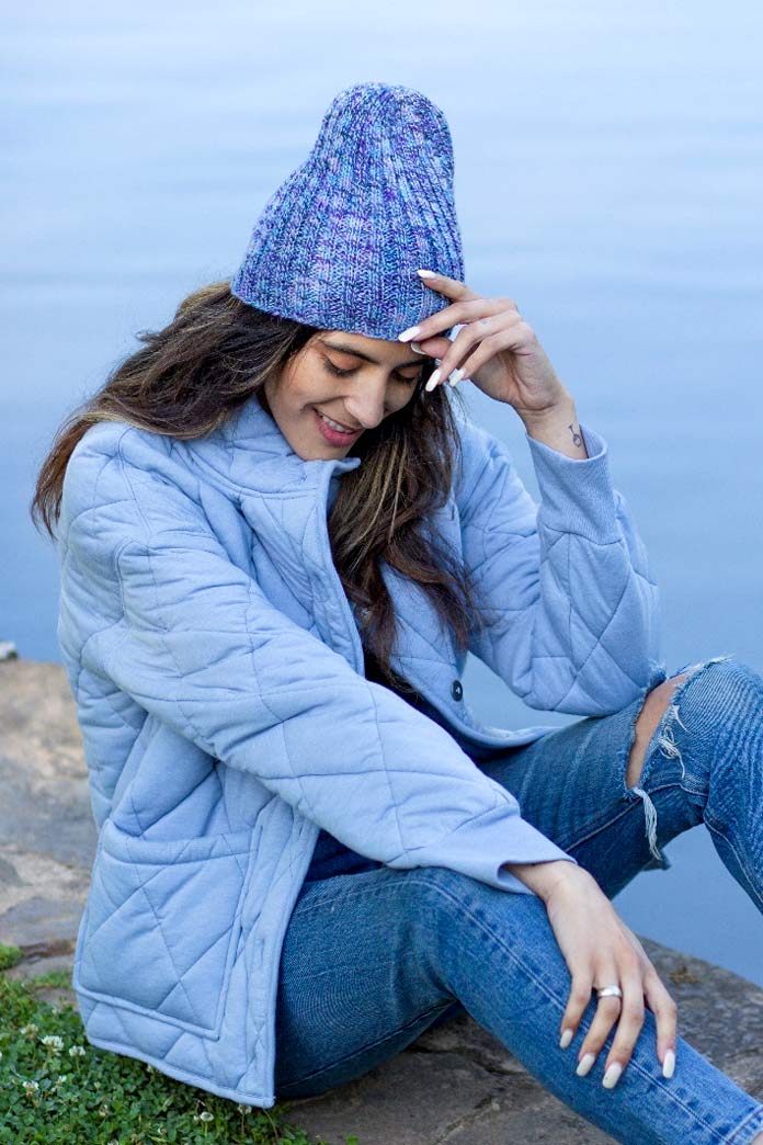 A woman wearing the Gallinule Hat designed by Rachel Brockman.