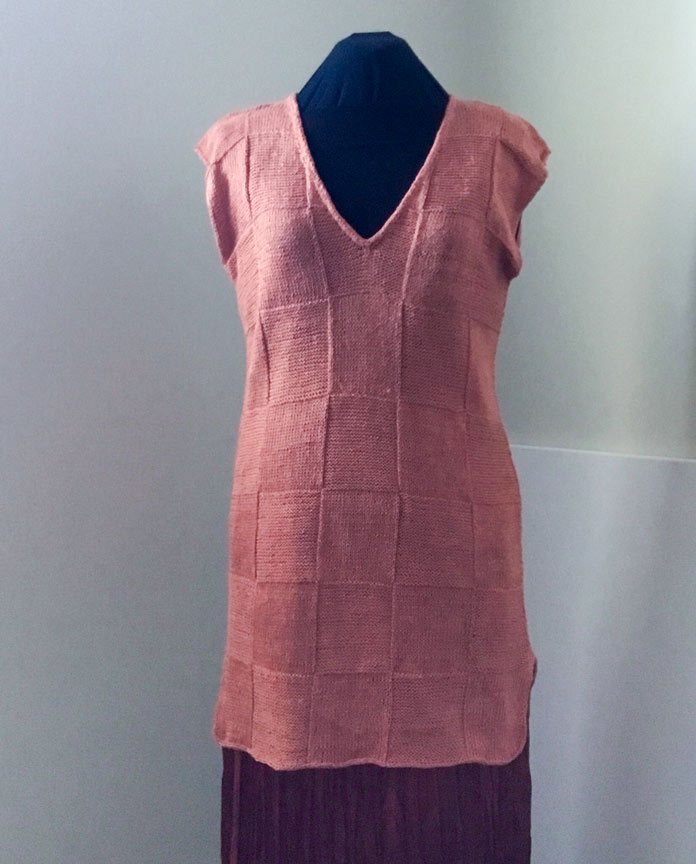 The finished Simple Summer Tunic in Fibra Natura FLAX on a black mannequin; Fibra Natura FLAX #1819 Yarn - 50g - Light Weight 3 - 125m (137yds) - Dusted Apricot