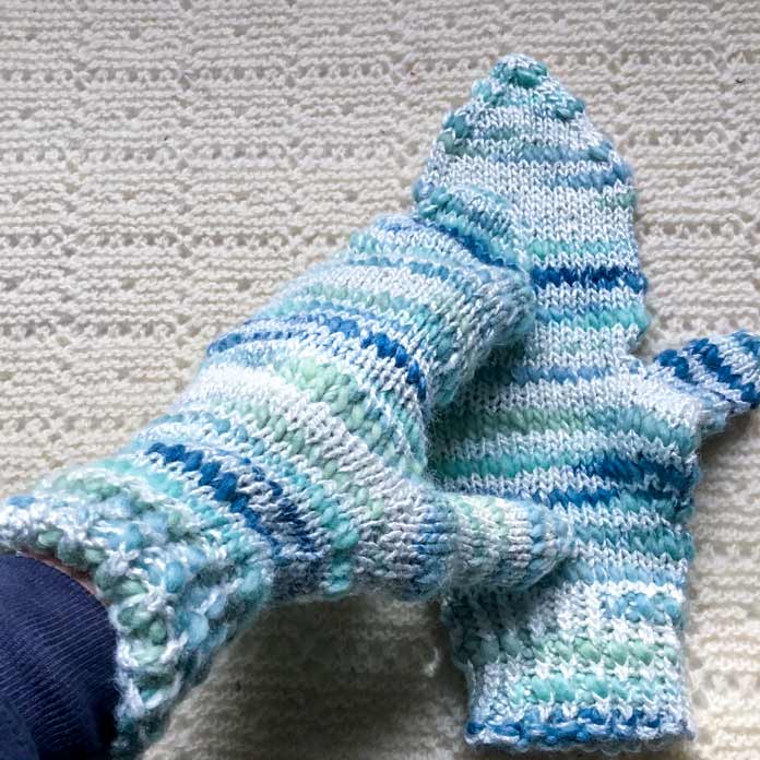 A pair of mittens knitted with Bamboo Bloom Handpaint.