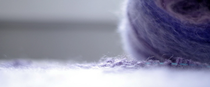Alpaca and mohair fibers create a glowing halo in the Grape Attack colorway of Revolutions yarn.