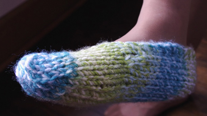 These comfortable, warm and soft slippers can be made in less than a day. You can see the halo around the stitches.