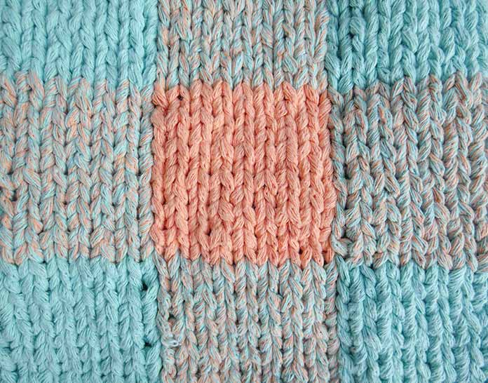 When knitting intarsia, the key to a neat finish is to make sure the stitches at the color changes have the same tension as the stitches in the rest of the knitting.