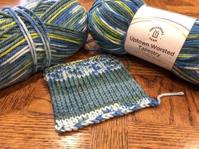Uptown Worsted Tapestry in the color Prairie Fields with a swatch so you can see how the colors knit up. It gives the impression of a faux Fair Isle or a self striping motif.